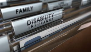 file folder with disability insurance on the tab